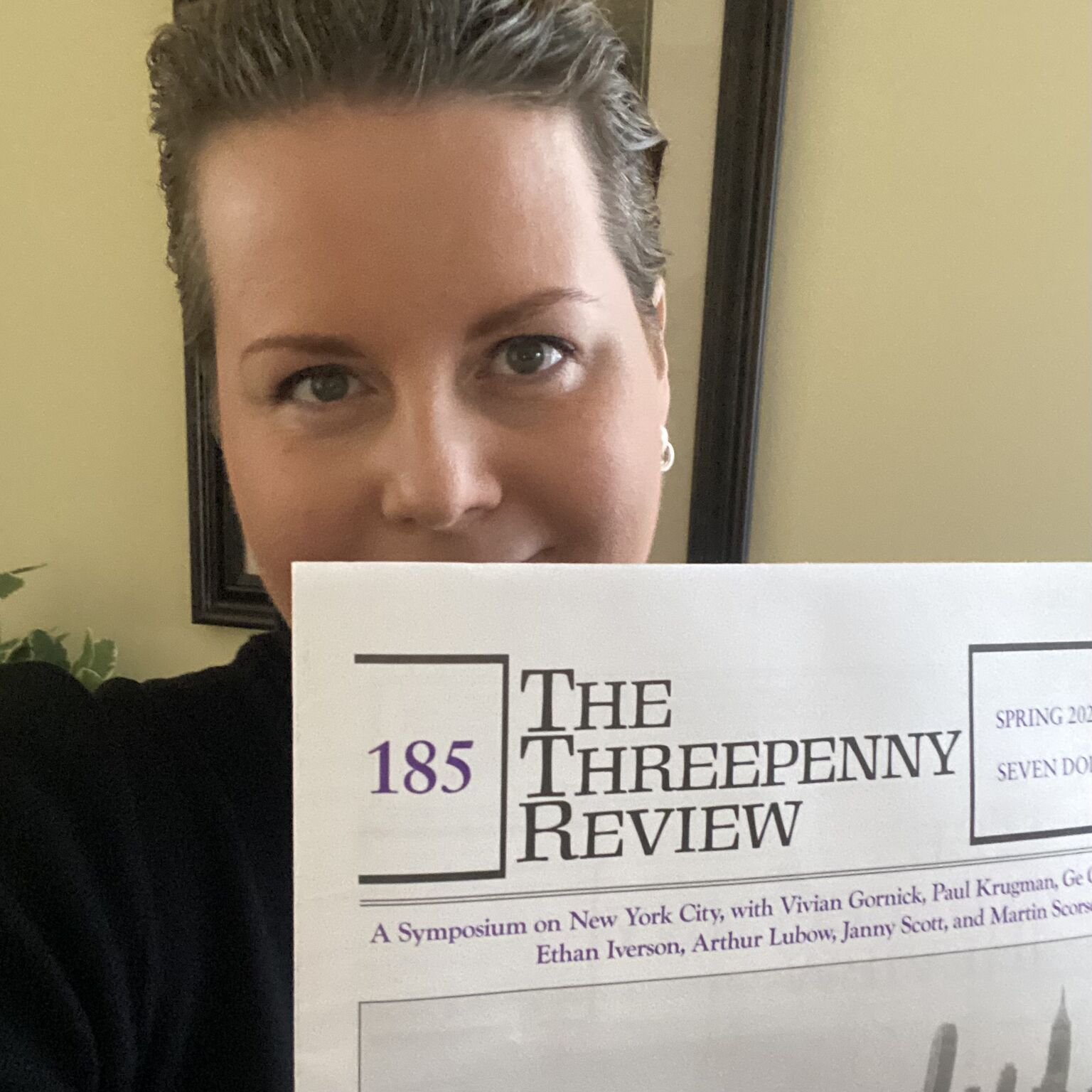 Lana Spendl, holding a copy of issue 185 of The Threepenny Review.